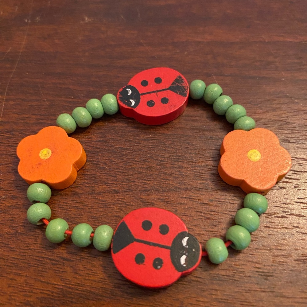 Vintage wood Childs bracelet ladybug and flowers